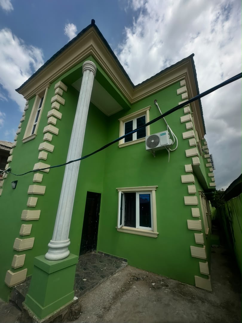 Front elevation of the completed multi-level residence in Nigeria